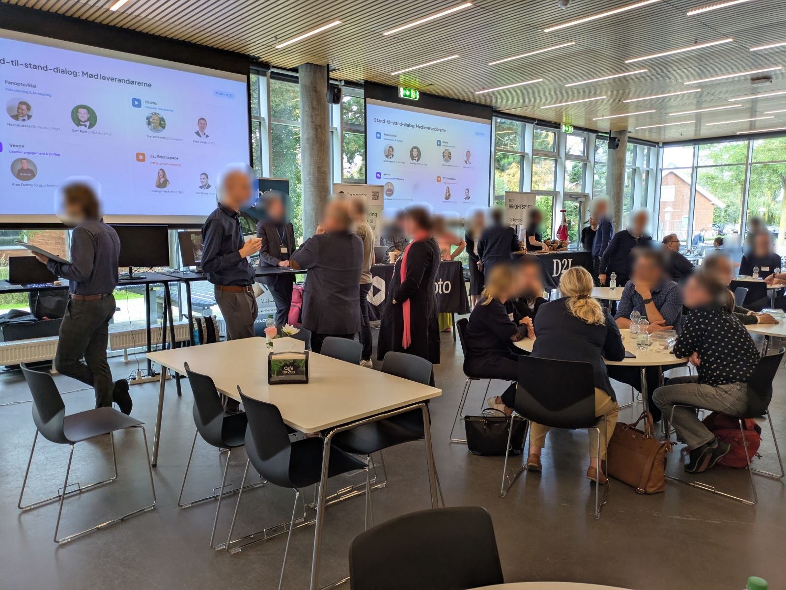 Participants talking at the partners’ stands at Viducon’s 2026 conference